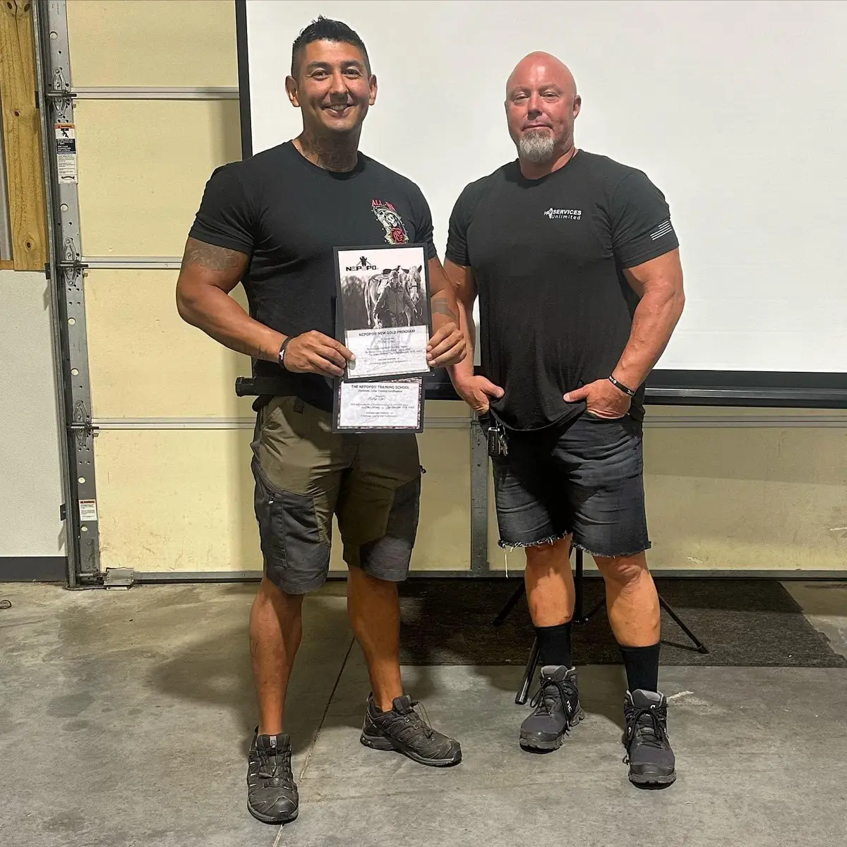 Mike Leal holding his NePoPo Gold completion certificates